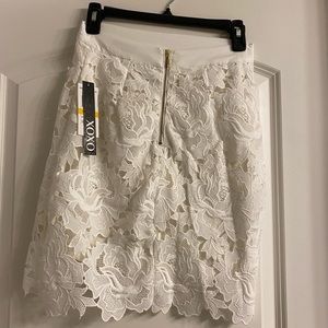 Ivory shirt top and straight skirt to knee. Never worn. Top is see through.